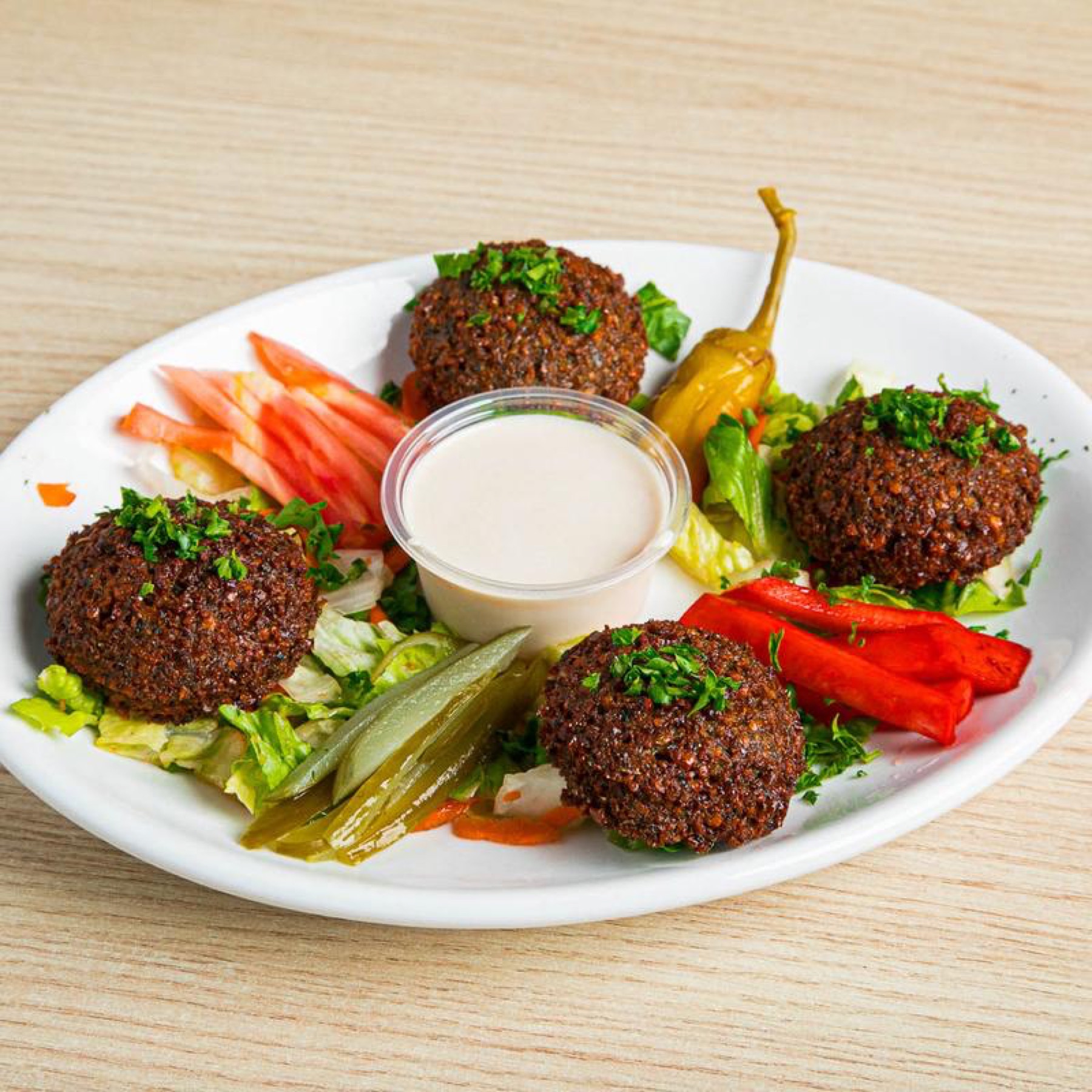 Falafel with tahini, pickled turnip and peppers